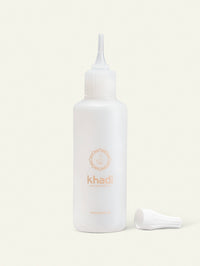 Imagen de botella aplicadora de champù khadi.